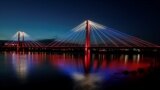 RUSSIA -- A general view shows the Vinogradovsky pedestrian bridge across the Yenisei River illuminated on the occasion of the National Flag Day in central Krasnoyarsk, Russia August 22, 2019. 